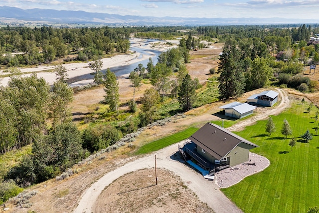 aerial view with a mountain view and a wooded view