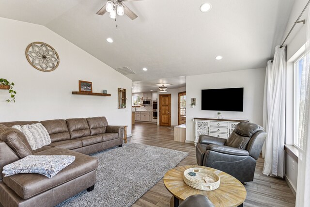 living area featuring recessed lighting, lofted ceiling, ceiling fan, and wood finished floors