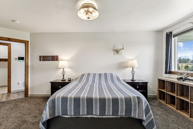 carpeted bedroom with baseboards