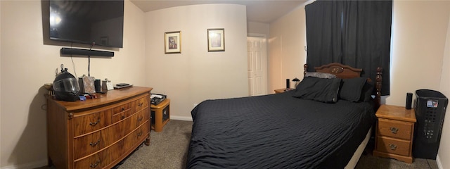 bedroom featuring baseboards and carpet floors