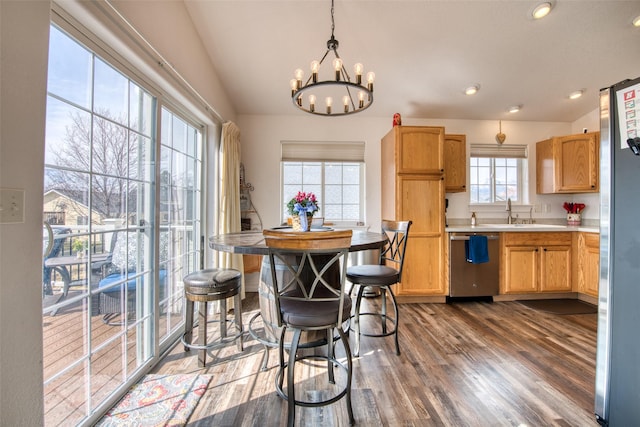 dining room featuring recessed lighting, a chandelier, dark wood-style flooring, and vaulted ceiling