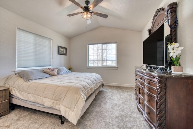 bedroom with light carpet, a textured ceiling, baseboards, ceiling fan, and vaulted ceiling