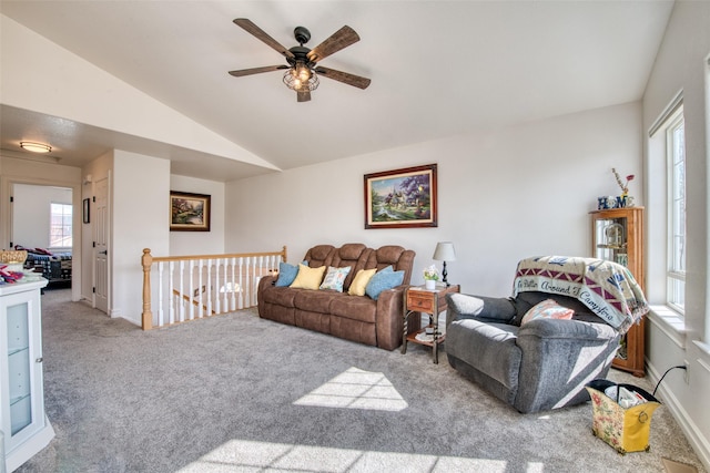 carpeted living room featuring lofted ceiling and a ceiling fan