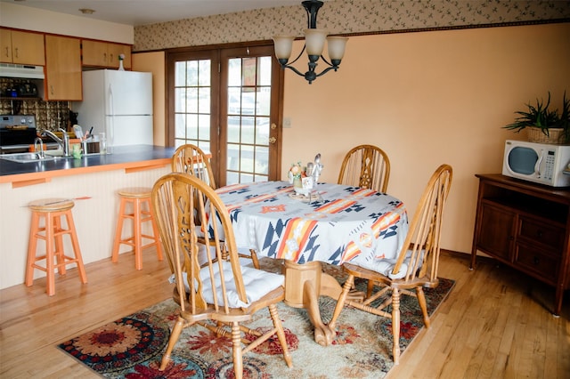 3676 Silverthorn Dr, Stevensville, MT 59870 - dining space featuring a chandelier and light wood finished floors