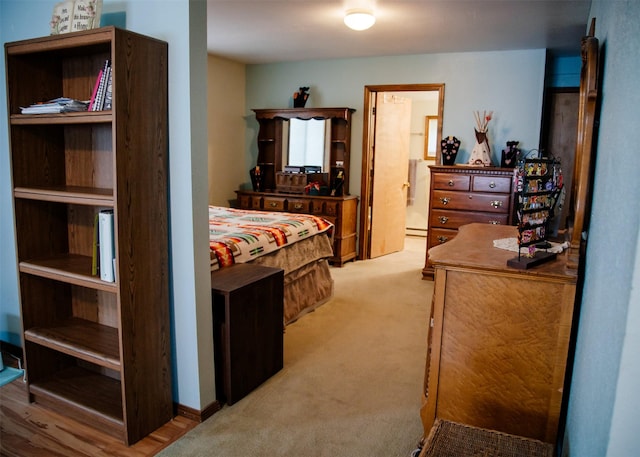 3676 Silverthorn Dr, Stevensville, MT 59870 - bedroom with light colored carpet, a baseboard heating unit, and ensuite bath