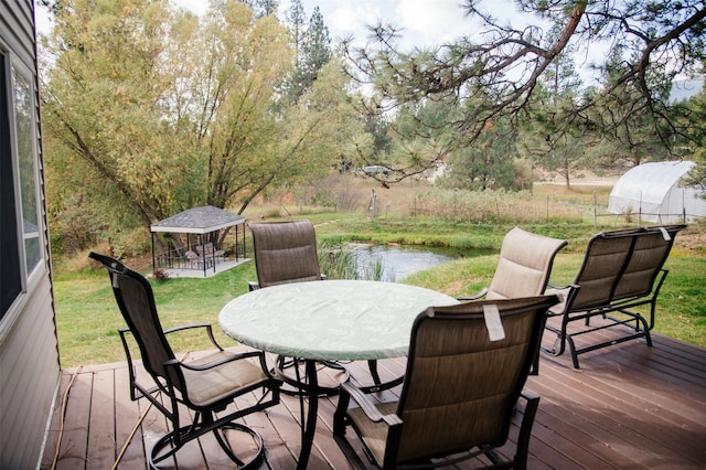 3676 Silverthorn Dr, Stevensville, MT 59870 - deck with a gazebo, outdoor dining space, and a lawn