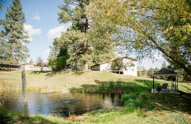 3676 Silverthorn Dr, Stevensville, MT 59870 - view of green lawn featuring a gazebo and a water view
