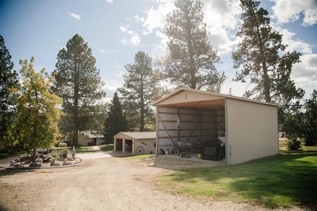 3676 Silverthorn Dr, Stevensville, MT 59870 - garage with driveway and a carport