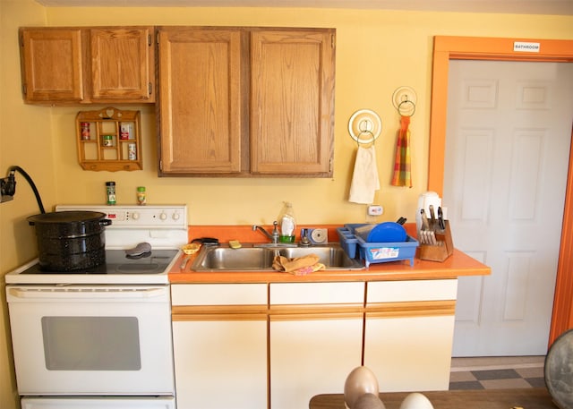 3676 Silverthorn Dr, Stevensville, MT 59870 - kitchen featuring white electric range oven, tile patterned floors, and light countertops