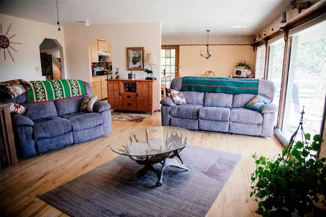 3676 Silverthorn Dr, Stevensville, MT 59870 - living room featuring light wood-type flooring and arched walkways