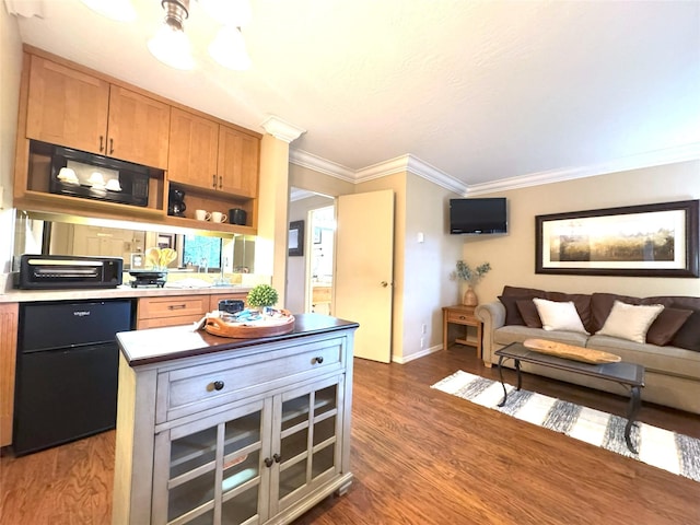 180 Vista Ln Unit 238, Bigfork, MT 59911 - kitchen featuring black microwave, ornamental molding, baseboards, dark wood-style floors, and open floor plan