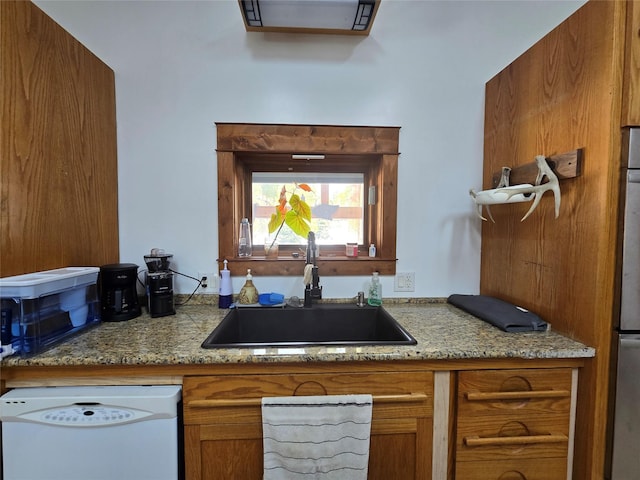 611 S Canyon Dr, Seeley Lake, MT 59868 - kitchen featuring dishwasher and brown cabinets