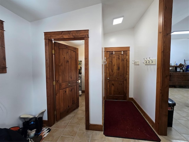 611 S Canyon Dr, Seeley Lake, MT 59868 - foyer featuring lofted ceiling and light tile patterned floors
