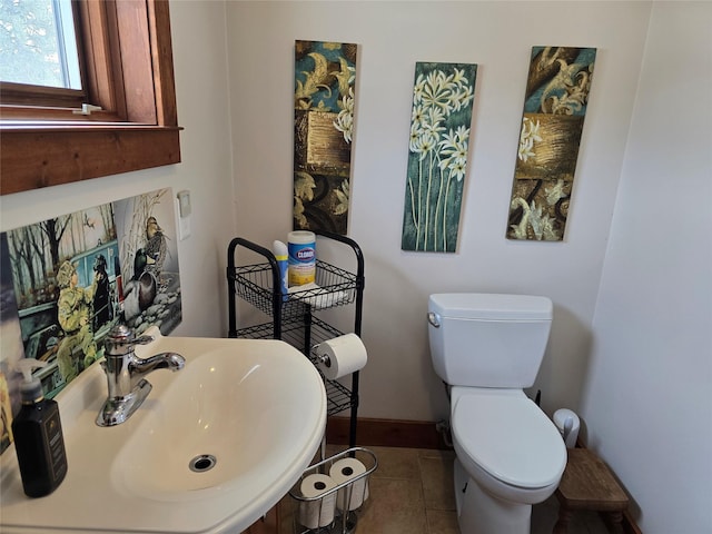 611 S Canyon Dr, Seeley Lake, MT 59868 - half bathroom featuring toilet and tile patterned flooring