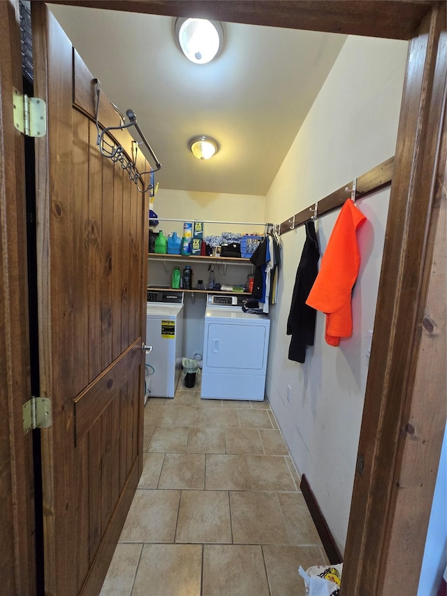611 S Canyon Dr, Seeley Lake, MT 59868 - washroom featuring washer and clothes dryer and baseboards