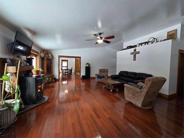 611 S Canyon Dr, Seeley Lake, MT 59868 - living area featuring a wood stove, hardwood / wood-style floors, a ceiling fan, and vaulted ceiling