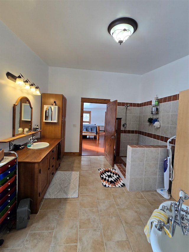 611 S Canyon Dr, Seeley Lake, MT 59868 - bathroom with vanity, tile patterned floors, and a tile shower