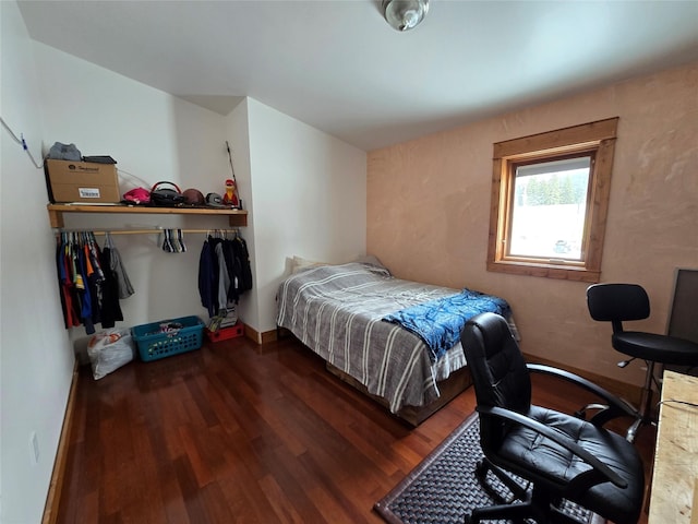 611 S Canyon Dr, Seeley Lake, MT 59868 - bedroom with wood finished floors and baseboards