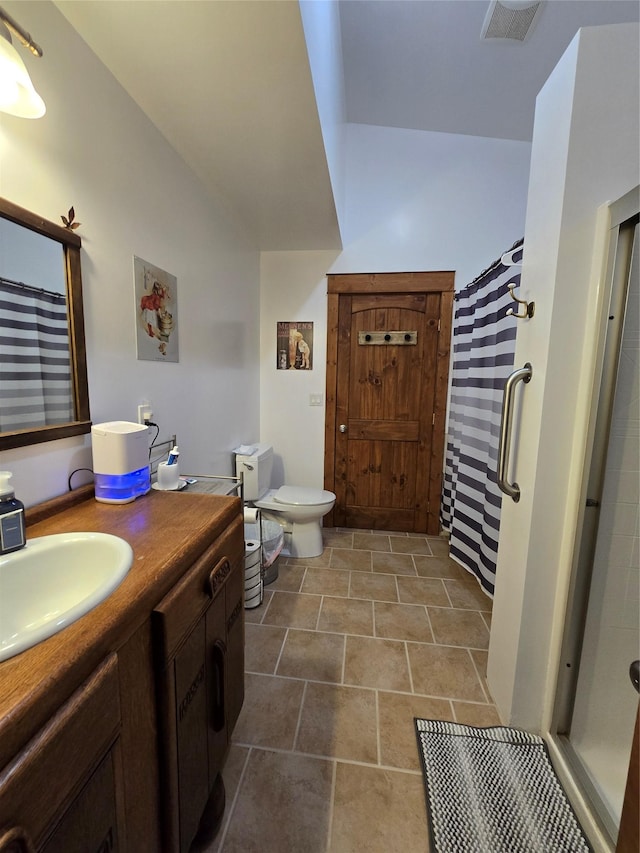 611 S Canyon Dr, Seeley Lake, MT 59868 - full bath featuring lofted ceiling, a shower stall, and vanity