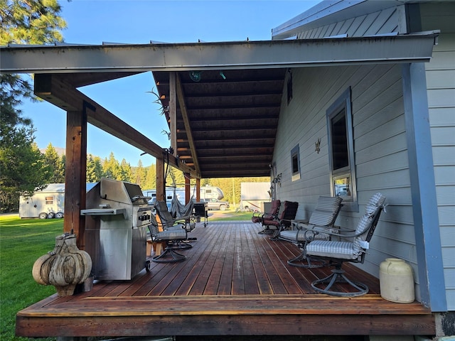 611 S Canyon Dr, Seeley Lake, MT 59868 - wooden terrace with grilling area and a yard