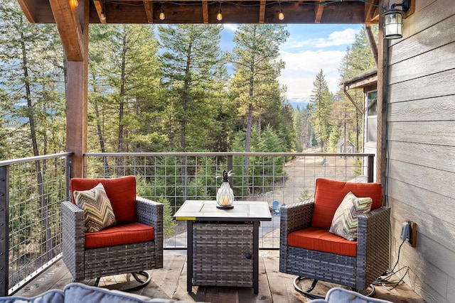 378 Skookum Rd, Lakeside, MT 59922 - balcony featuring a forest view
