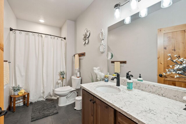 378 Skookum Rd, Lakeside, MT 59922 - full bathroom with toilet, tile patterned flooring, vanity, and a shower with curtain