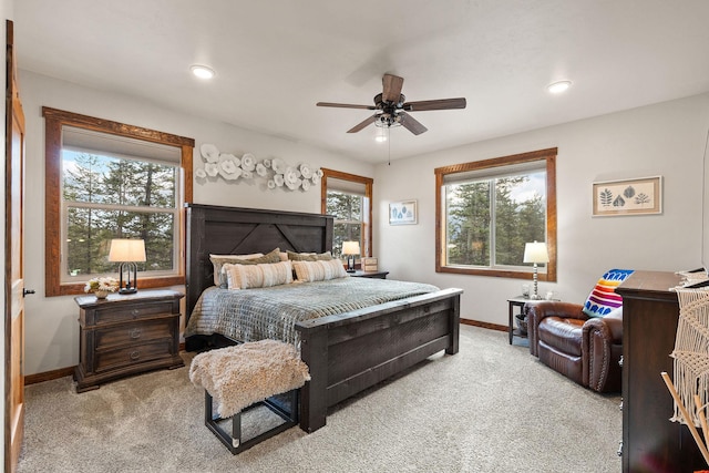 378 Skookum Rd, Lakeside, MT 59922 - carpeted bedroom with baseboards, multiple windows, and a ceiling fan