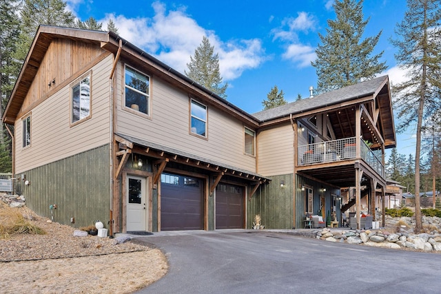 378 Skookum Rd, Lakeside, MT 59922 - view of front of home featuring driveway, a garage, and stairs
