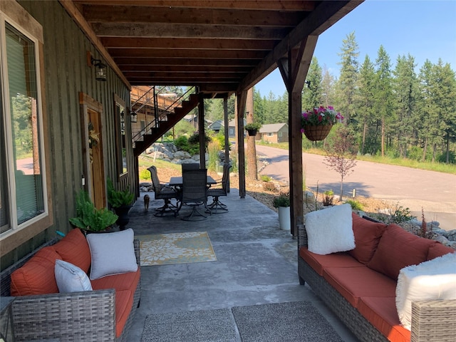 378 Skookum Rd, Lakeside, MT 59922 - view of patio with stairway, outdoor dining area, and an outdoor hangout area