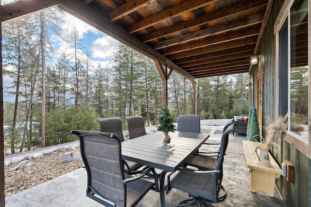 378 Skookum Rd, Lakeside, MT 59922 - view of patio featuring outdoor dining space and view of scattered trees