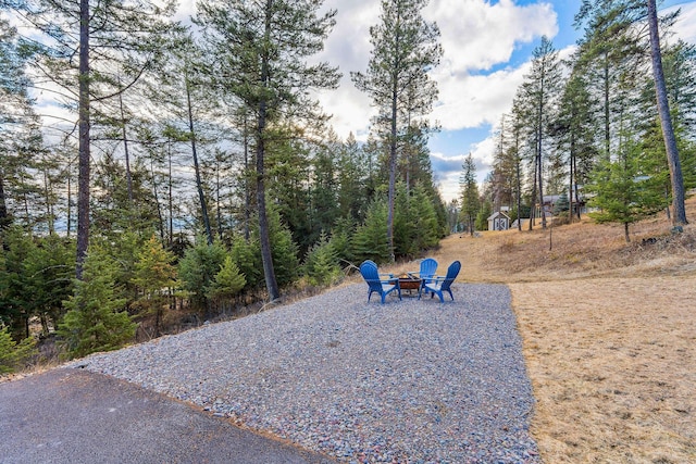 378 Skookum Rd, Lakeside, MT 59922 - surrounding community featuring a fire pit
