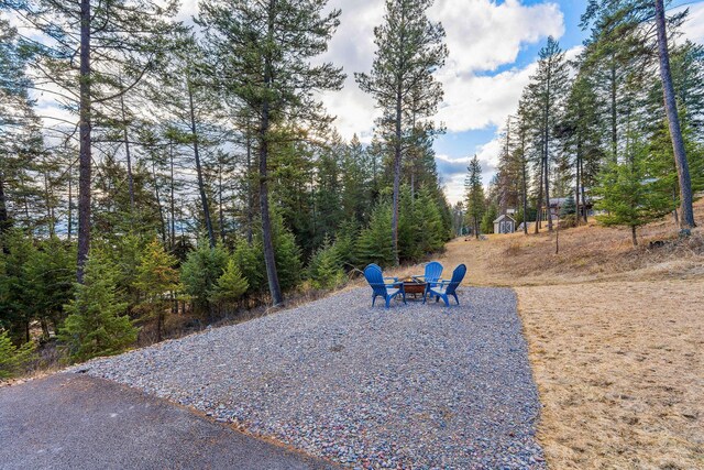 378 Skookum Rd, Lakeside, MT 59922 - view of yard featuring a fire pit