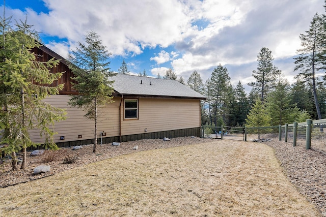 378 Skookum Rd, Lakeside, MT 59922 - view of home's exterior with a gate