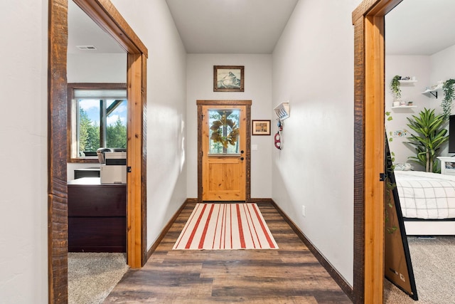 378 Skookum Rd, Lakeside, MT 59922 - doorway to outside featuring wood finished floors and baseboards