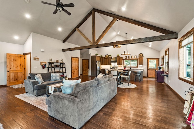 378 Skookum Rd, Lakeside, MT 59922 - living room with a ceiling fan, dark wood-style flooring, high vaulted ceiling, beam ceiling, and a chandelier