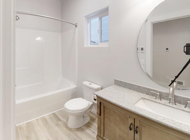 3805 US Highway 93 N, Eureka, MT 59917 - full bathroom featuring vanity, wood finished floors, and shower / tub combination