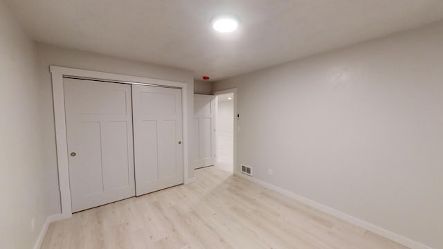 3805 US Highway 93 N, Eureka, MT 59917 - unfurnished bedroom featuring light wood-style floors and a closet