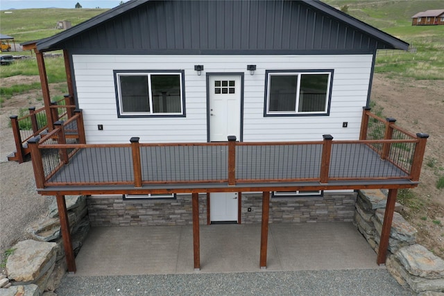 3805 US Highway 93 N, Eureka, MT 59917 - rear view of house featuring a deck and a patio area