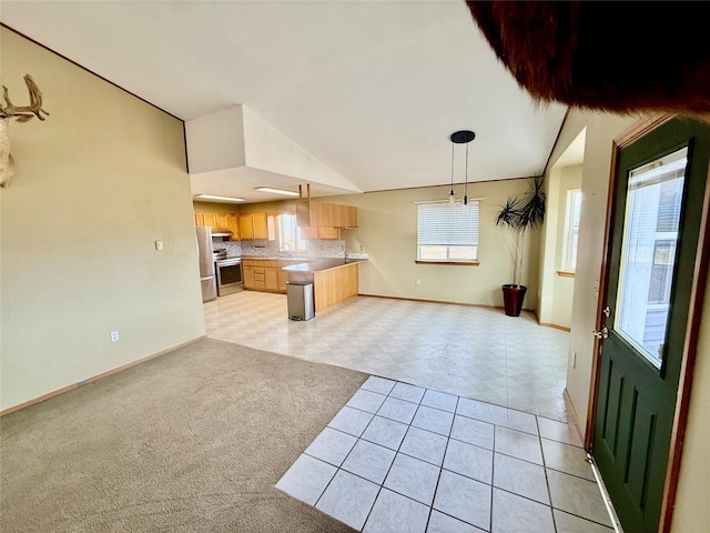 54650 Herak Rd, Charlo, MT 59824 - kitchen with stainless steel range with electric stovetop, open floor plan, light countertops, light brown cabinets, and baseboards
