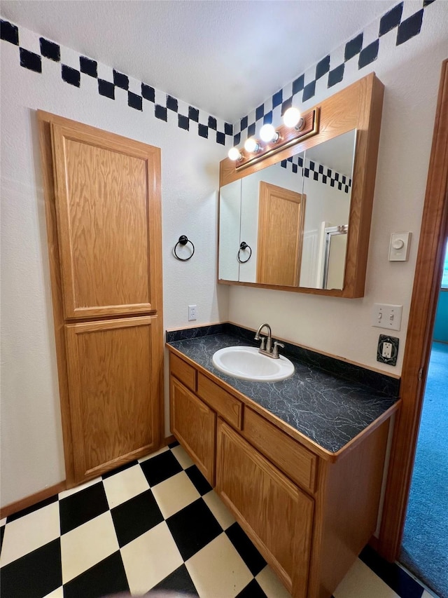54650 Herak Rd, Charlo, MT 59824 - bathroom featuring tile patterned floors and vanity