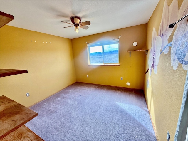 54650 Herak Rd, Charlo, MT 59824 - empty room with baseboards, ceiling fan, and carpet floors