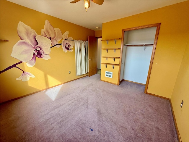 54650 Herak Rd, Charlo, MT 59824 - unfurnished bedroom with carpet, a closet, baseboards, and a ceiling fan