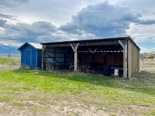 54650 Herak Rd, Charlo, MT 59824 - view of pole building with a detached carport and a mountain view