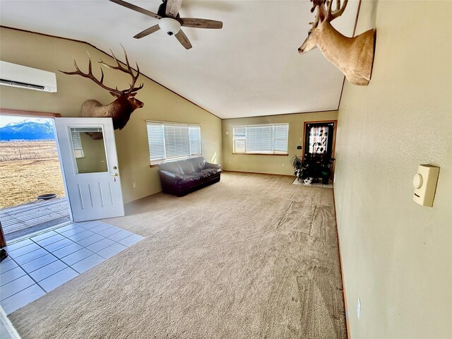 54650 Herak Rd, Charlo, MT 59824 - interior space featuring lofted ceiling, a wall mounted AC, a ceiling fan, and carpet flooring