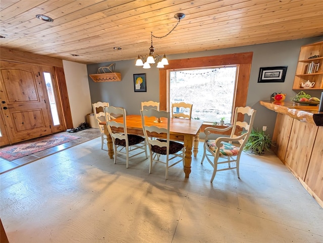 dining room with an inviting chandelier and wood ceiling