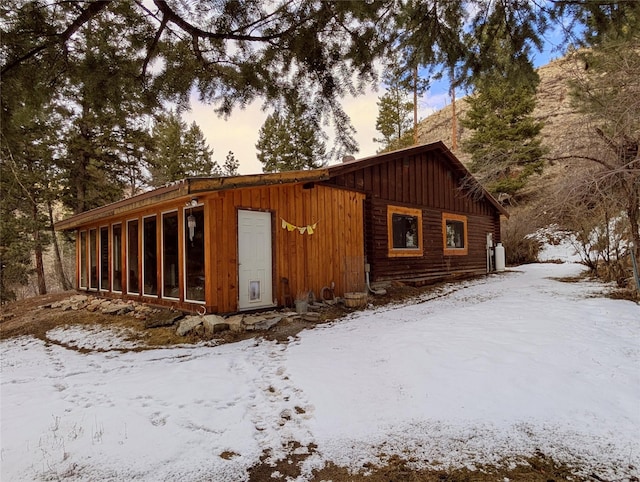 exterior space featuring a sunroom