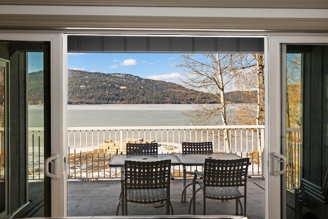 doorway to outside featuring a water view