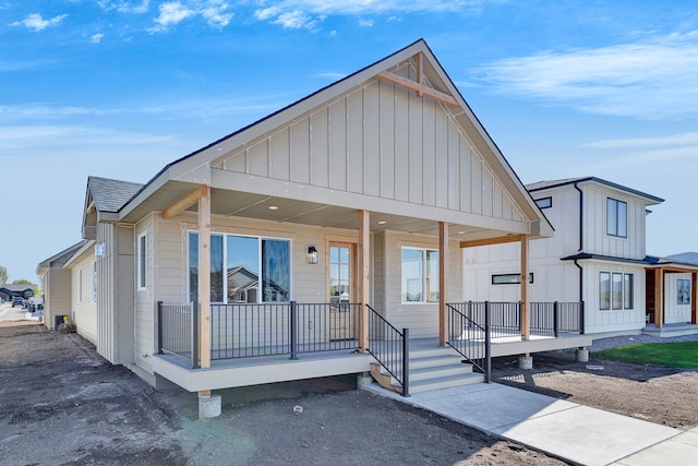 5665 Cattle Dr, Missoula, MT 59808 - view of front of house featuring board and batten siding and a porch