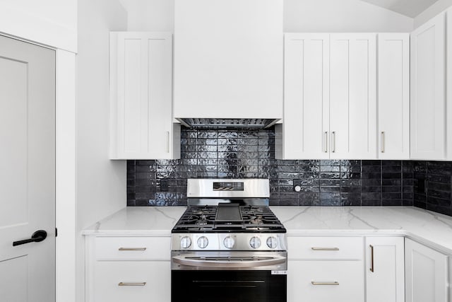 5665 Cattle Dr, Missoula, MT 59808 - kitchen featuring stainless steel gas range oven, tasteful backsplash, white cabinets, and light stone counters