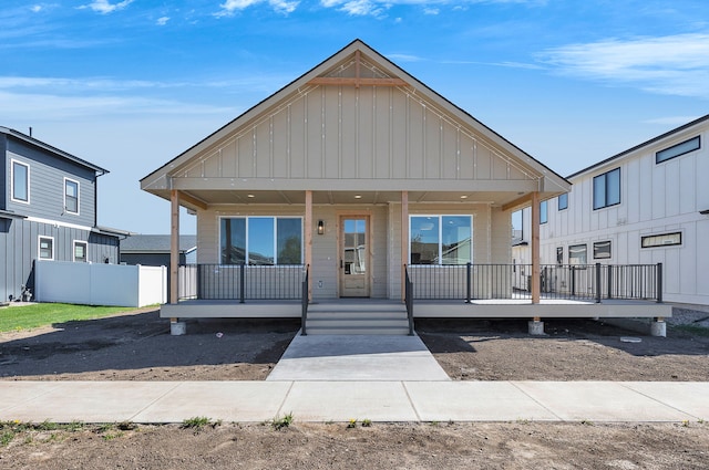 5665 Cattle Dr, Missoula, MT 59808 - view of front of home featuring covered porch and board and batten siding